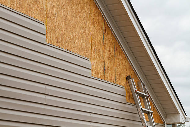 Professional Vinyl Siding technician working in Wyano, PA